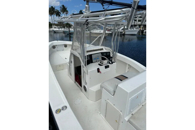  Yacht Photos Pics 2004 Ocean Master 31 Center Console boat docked, featuring spacious deck and helm.