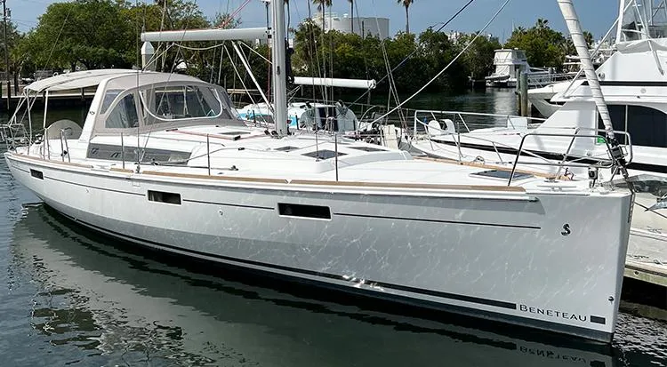 New Horizon Yacht Photos Pics 2018 Beneteau Oceanis 45 sailboat docked in a marina, side view.