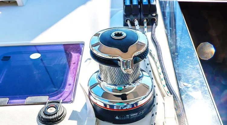 New Horizon Yacht Photos Pics Winch system on 2018 Beneteau Oceanis 45 sailboat deck, featuring polished metal and control lines.