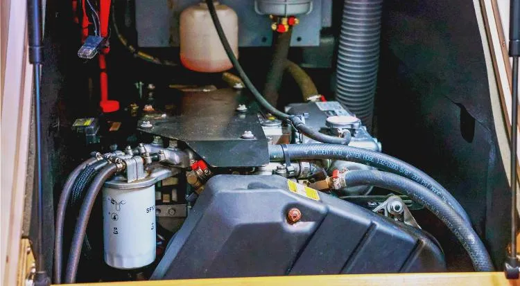 New Horizon Yacht Photos Pics Engine compartment of 2018 Beneteau Oceanis 45 sailboat, showcasing mechanical components and hoses.