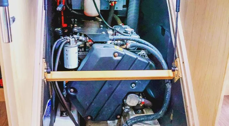 New Horizon Yacht Photos Pics Engine compartment of a 2018 Beneteau Oceanis 45 sailboat, showcasing mechanical components.