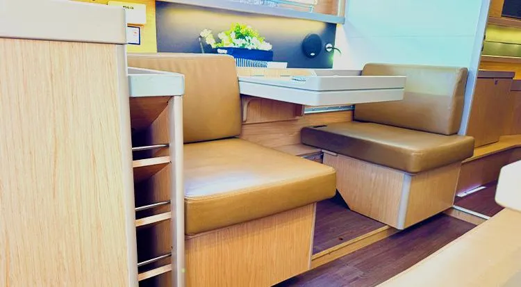 New Horizon Yacht Photos Pics Interior of 2018 Beneteau Oceanis 45 yacht with leather seating and wooden finishes.