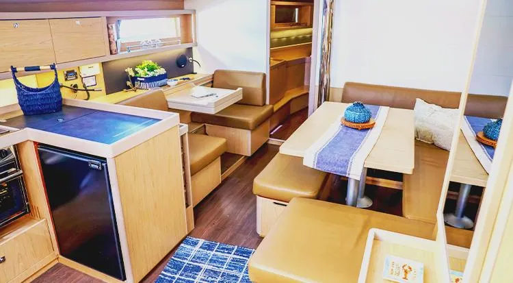 New Horizon Yacht Photos Pics Interior of 2018 Beneteau Oceanis 45 yacht, featuring modern kitchen and dining area.