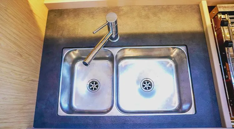 New Horizon Yacht Photos Pics Double stainless steel sink with modern faucet on Beneteau Oceanis 45 yacht, 2018 model.