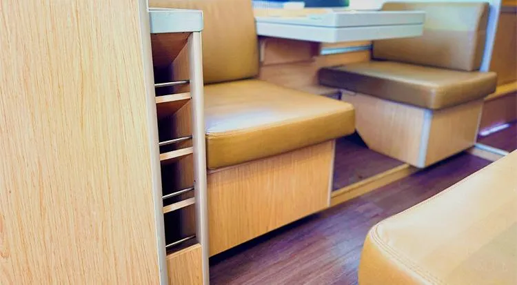 New Horizon Yacht Photos Pics Interior of 2018 Beneteau Oceanis 45 yacht with wooden finish and leather seating.