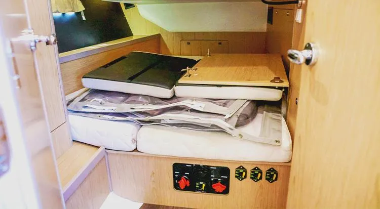 New Horizon Yacht Photos Pics Interior cabin of 2018 Beneteau Oceanis 45 yacht with storage and control panel.