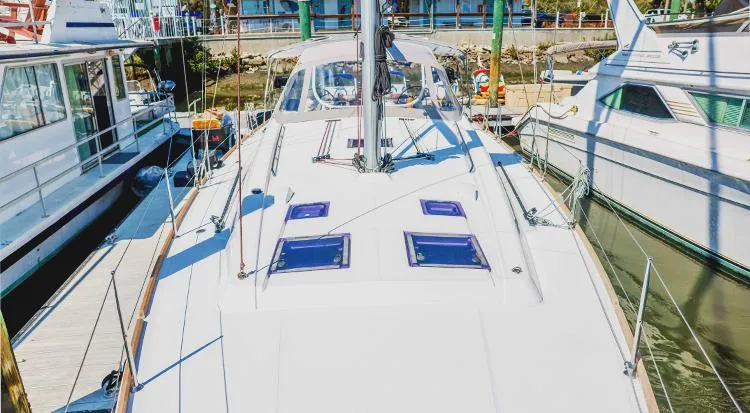 New Horizon Yacht Photos Pics 2018 Beneteau Oceanis 45 sailboat docked at marina, top deck view.