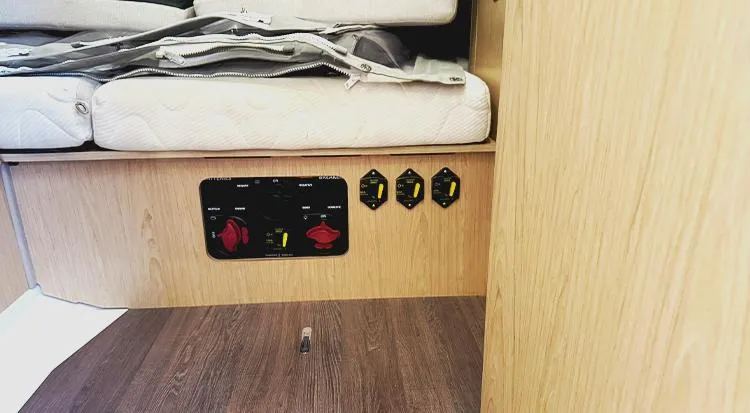 New Horizon Yacht Photos Pics Interior of 2018 Beneteau Oceanis 45 yacht showing control panel and storage area.