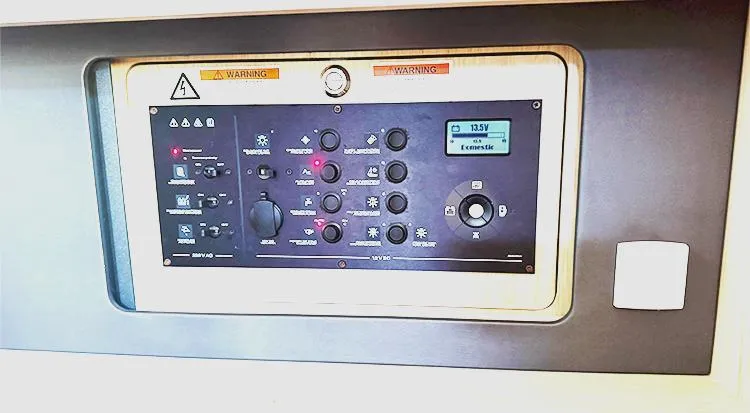 New Horizon Yacht Photos Pics Control panel of a 2018 Beneteau Oceanis 45 yacht, featuring various switches and a digital display.
