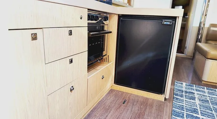 New Horizon Yacht Photos Pics Interior of 2018 Beneteau Oceanis 45 yacht kitchen with fridge and oven.