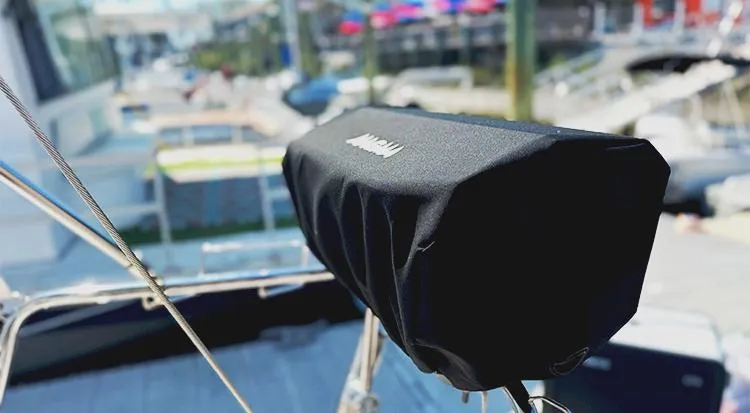 New Horizon Yacht Photos Pics Beneteau Oceanis 45 (2018) sailboat with covered equipment on deck, marina background.