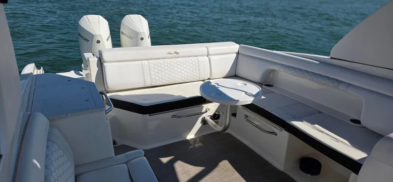  Yacht Photos Pics 2019 Sea Ray SDX 290 Outboard boat interior with seating and table on water.