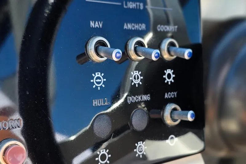  Yacht Photos Pics Control panel of 2019 Sea Ray SDX 290 Outboard boat with labeled switches.