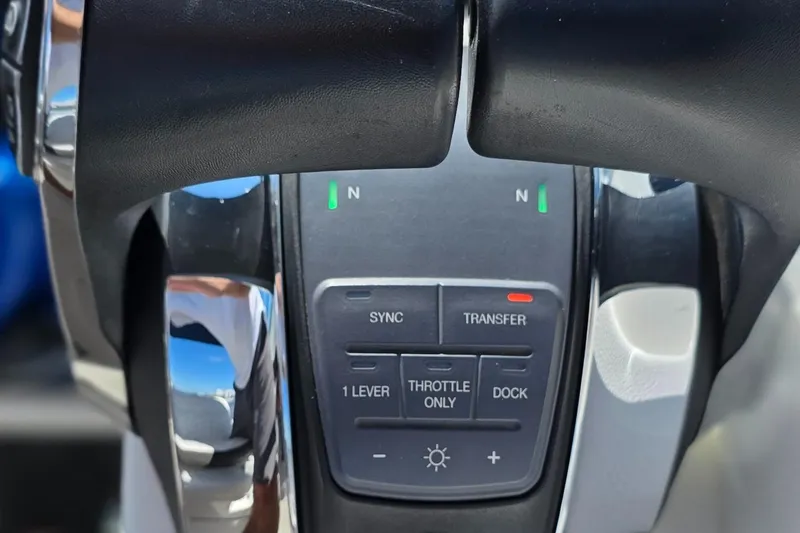  Yacht Photos Pics Close-up of 2019 Sea Ray SDX 290 Outboard throttle controls with buttons and indicators.