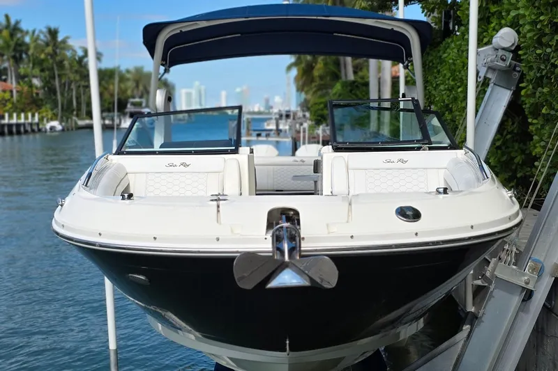  Yacht Photos Pics 2019 Sea Ray SDX 290 Outboard boat docked on a sunny waterfront.