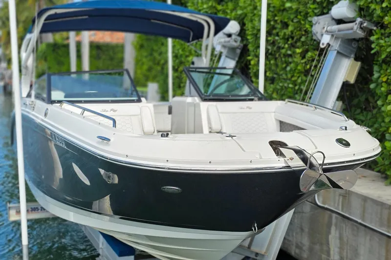  Yacht Photos Pics 2019 Sea Ray SDX 290 Outboard boat docked with blue canopy and sleek design.