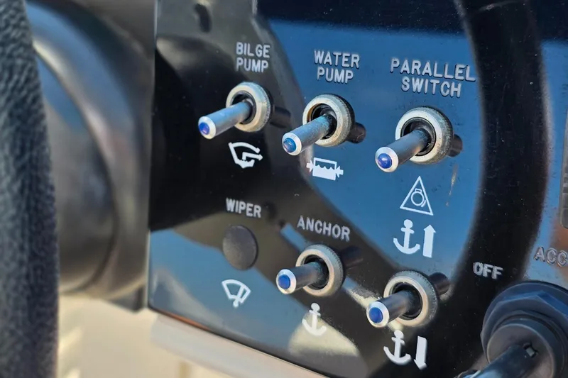 Yacht Photos Pics Control panel of a 2019 Sea Ray SDX 290 Outboard boat with various switches.