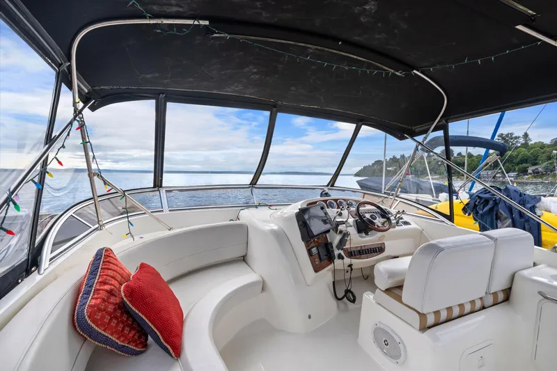 Barbarrick Yacht Photos Pics Interior of 2006 Meridian 411 Sedan yacht with helm, seating, and ocean view.