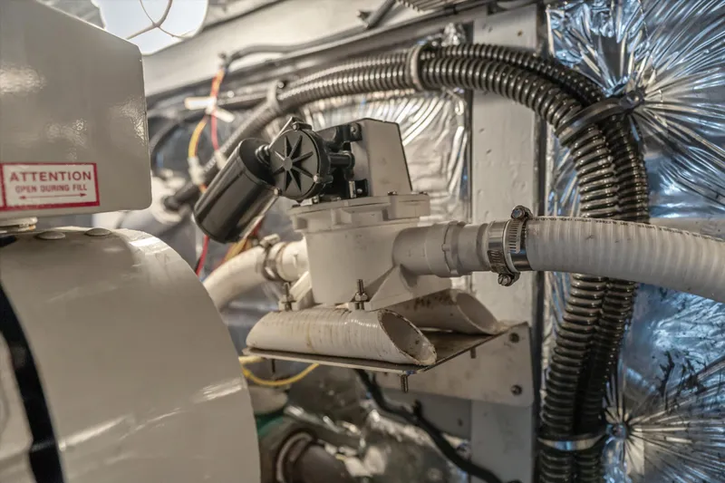 Barbarrick Yacht Photos Pics Engine room of 2006 Meridian 411 Sedan with hoses and mechanical components.