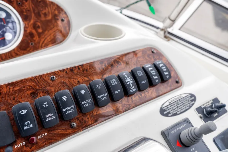 Barbarrick Yacht Photos Pics Control panel of a 2006 Meridian 411 Sedan boat with various switches and dials.