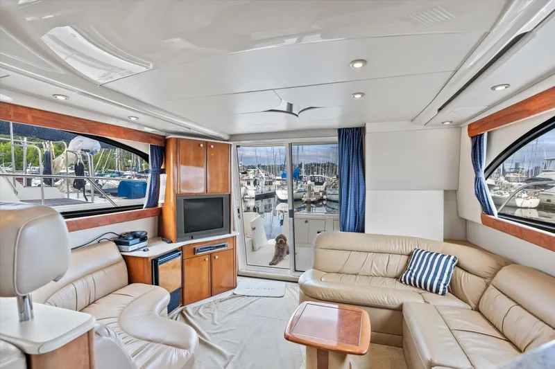 Barbarrick Yacht Photos Pics Luxurious interior of 2006 Meridian 411 Sedan yacht with leather seating and marina view.