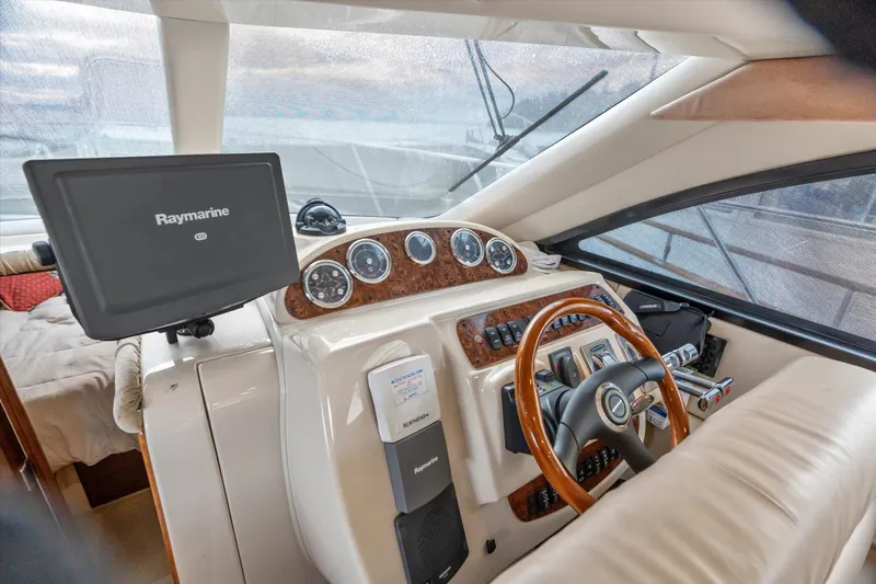 Barbarrick Yacht Photos Pics Interior helm of 2006 Meridian 411 Sedan with Raymarine navigation system.