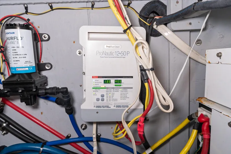 Barbarrick Yacht Photos Pics Electrical system in a 2006 Meridian 411 Sedan, featuring ProNautic charger and Shurflo pump.