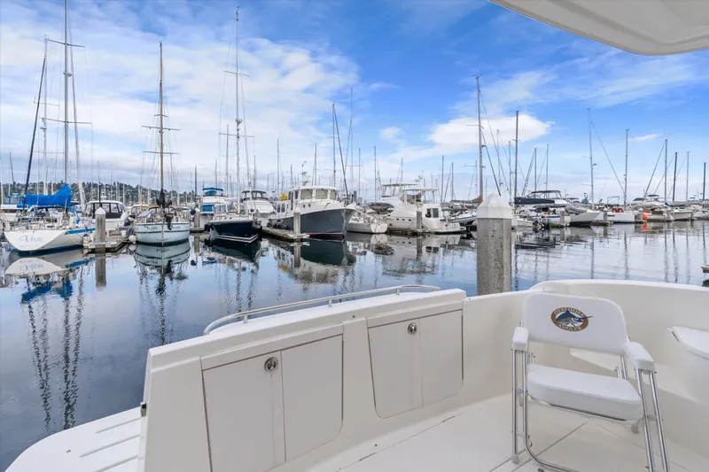 Barbarrick Yacht Photos Pics 2006 Meridian 411 Sedan yacht docked in a serene marina with sailboats.