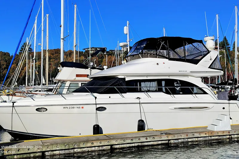 Barbarrick Yacht Photos Pics 2006 Meridian 411 Sedan yacht docked at marina with clear blue sky.