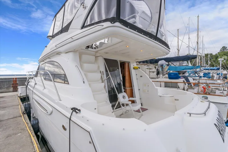 Barbarrick Yacht Photos Pics 2006 Meridian 411 Sedan yacht docked at marina, featuring spacious deck and modern design.