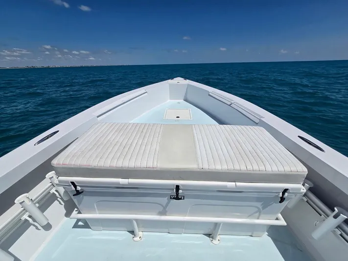  Yacht Photos Pics 2012 Contender Custom 33 Center Console boat on open sea under clear sky.