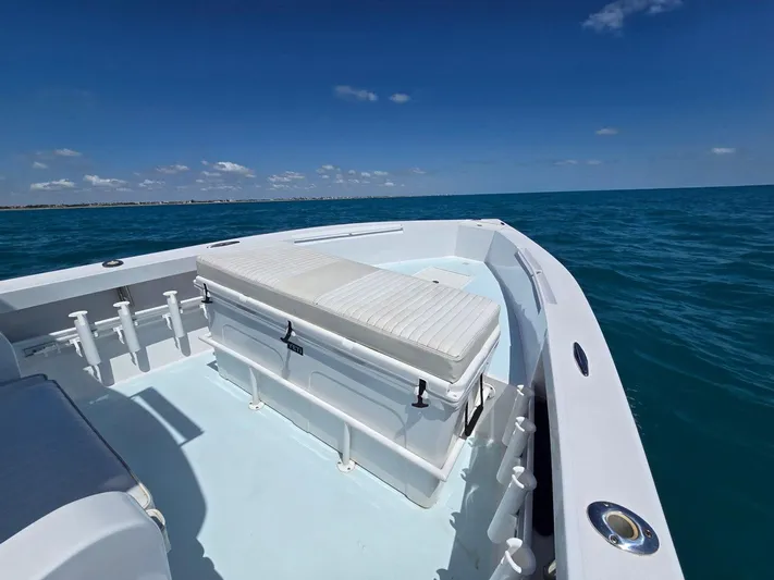  Yacht Photos Pics 2012 Contender Custom 33 Center Console boat on open sea under clear blue sky.