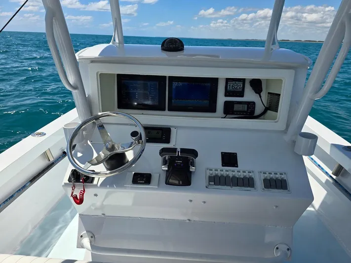  Yacht Photos Pics Center console of 2012 Contender Custom 33 boat on open sea.