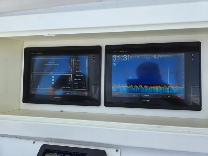  Yacht Photos Pics Garmin marine displays on 2012 Contender Custom 33 Center Console boat dashboard.