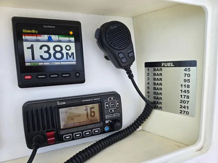  Yacht Photos Pics 2012 Contender Custom 33 Center Console dashboard with Garmin and Icom marine electronics.