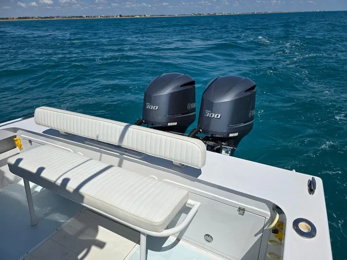 Yacht Photos Pics 2012 Contender Custom 33 Center Console boat with twin 300 horsepower engines on open water.