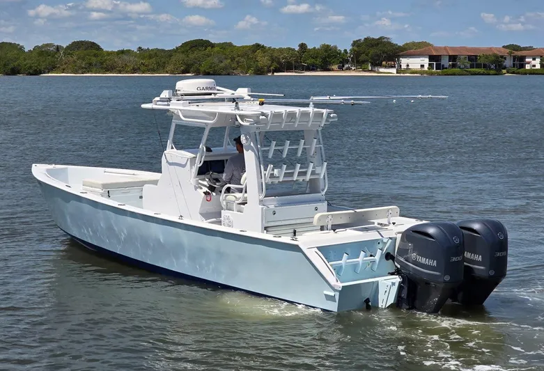  Yacht Photos Pics 2012 Contender Custom 33 Center Console boat on calm water, featuring dual Yamaha engines.