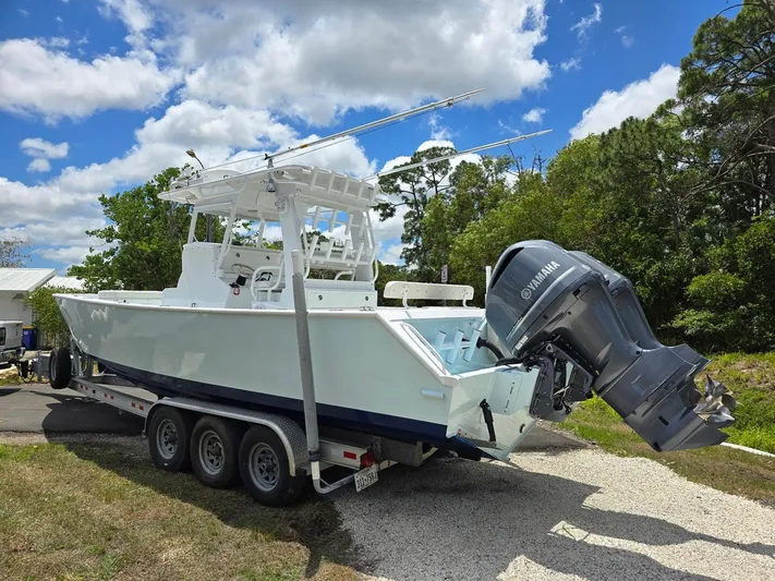  Yacht Photos Pics 2012 Contender Custom 33 Center Console boat on trailer with Yamaha outboard motor.