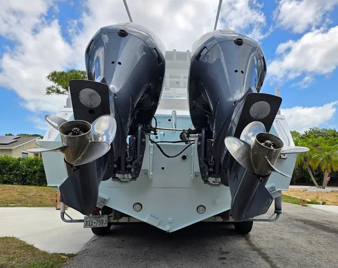  Yacht Photos Pics 2012 Contender Custom 33 Center Console with dual outboard engines, rear view.