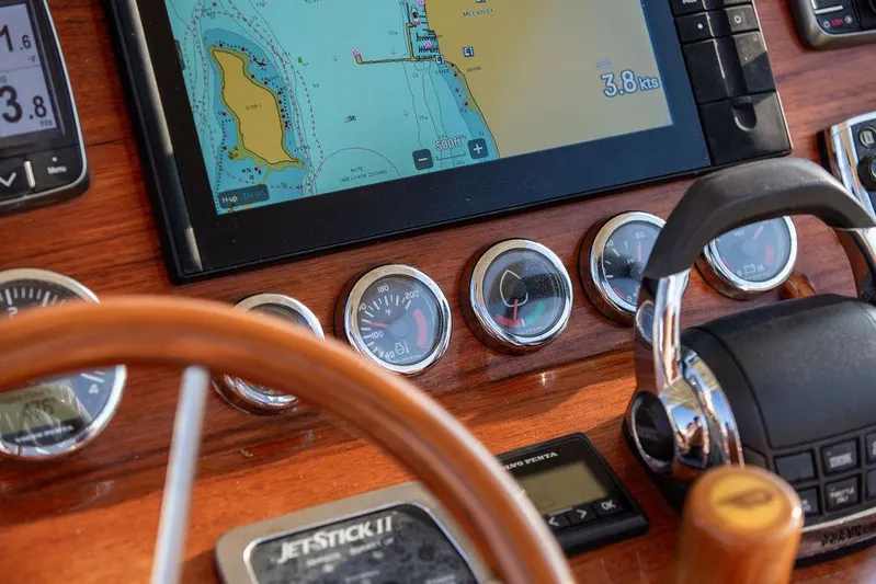 Cheetah Yacht Photos Pics Hinckley T29 CC 2014 dashboard with navigation screen and controls, showcasing nautical instruments.