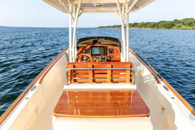 Cheetah Yacht Photos Pics 2014 Hinckley T29 CC boat with wooden dashboard on open water.