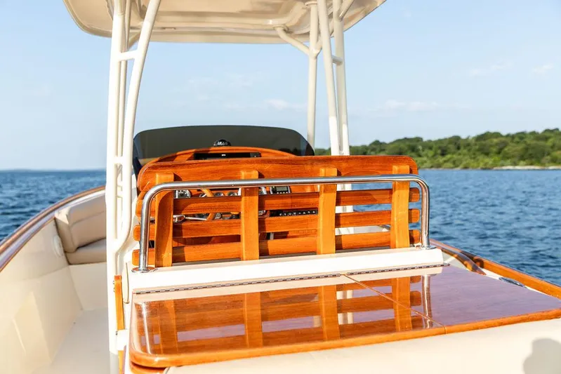 Cheetah Yacht Photos Pics 2014 Hinckley T29 CC boat with polished wood finish on open water.