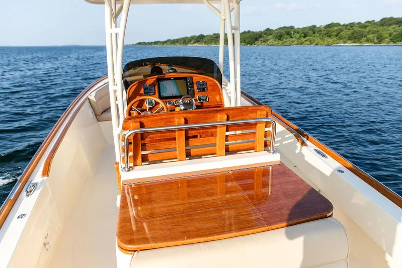 Cheetah Yacht Photos Pics 2014 Hinckley T29 CC boat with polished wood interior on open water.