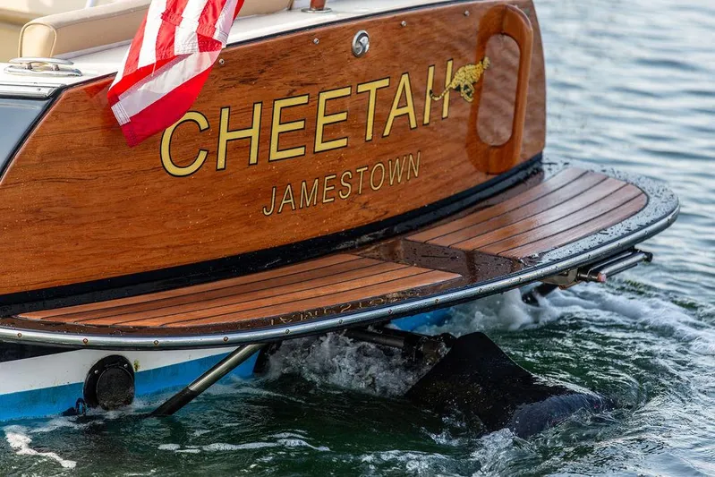 Cheetah Yacht Photos Pics Hinckley T29 CC 2014 boat named "Cheetah" with American flag on water.
