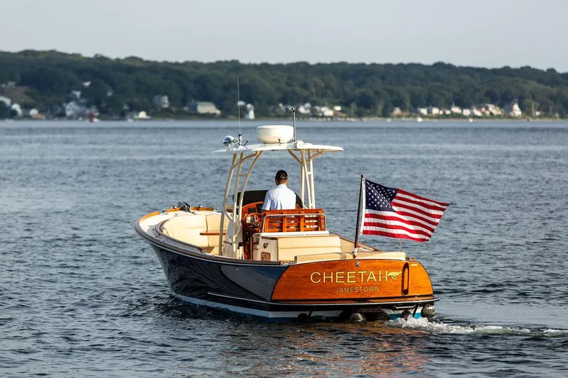 Cheetah Yacht Photos Pics 2014 Hinckley T29 CC boat on water, American flag, scenic background.