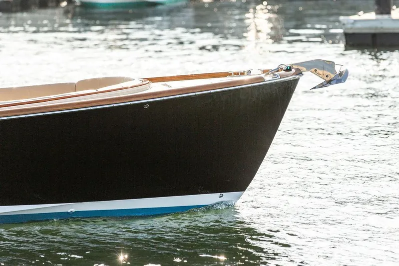 Cheetah Yacht Photos Pics Hinckley T29 CC 2014 boat bow on water, showcasing sleek design and craftsmanship.