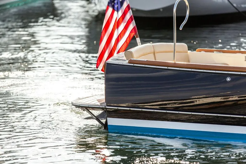 Cheetah Yacht Photos Pics Hinckley T29 CC 2014 boat with American flag on water.