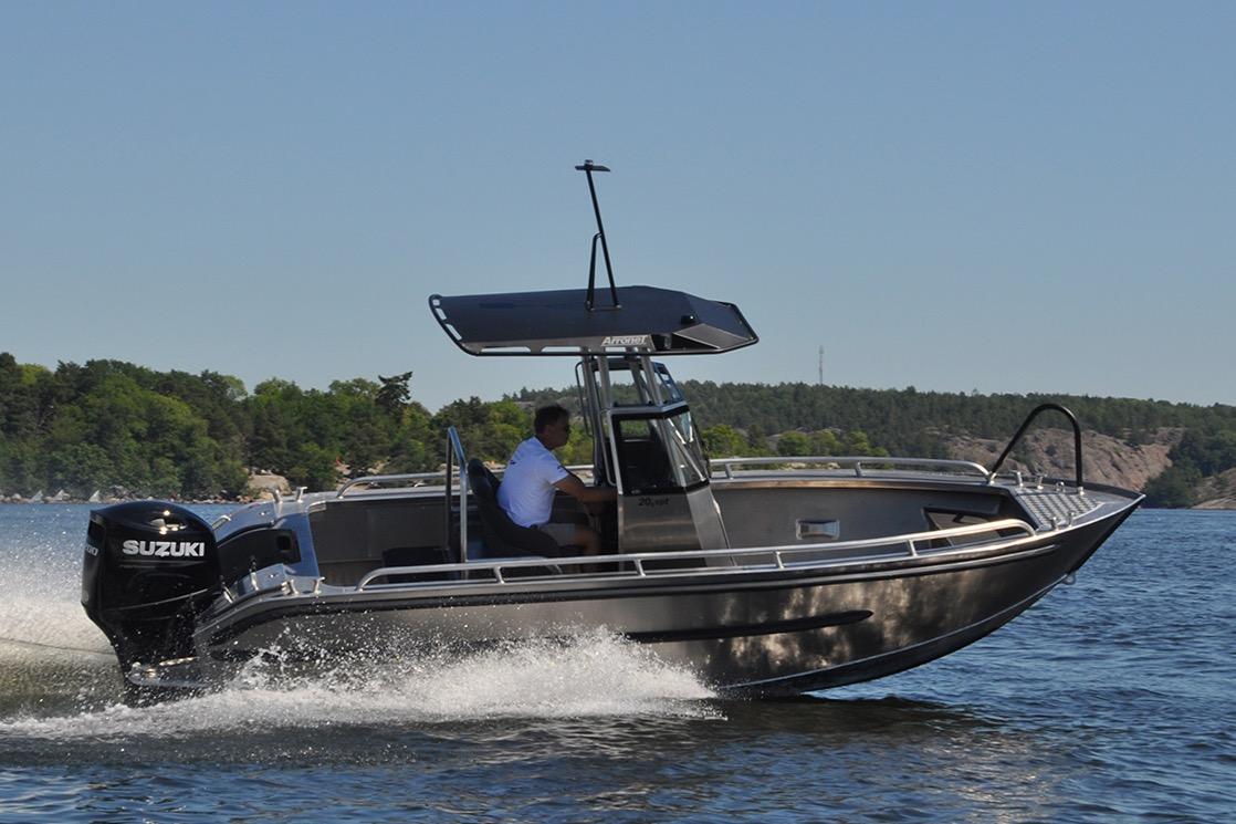2024 Arronet 20 5 SPT boat cruising on a lake with Suzuki engine.