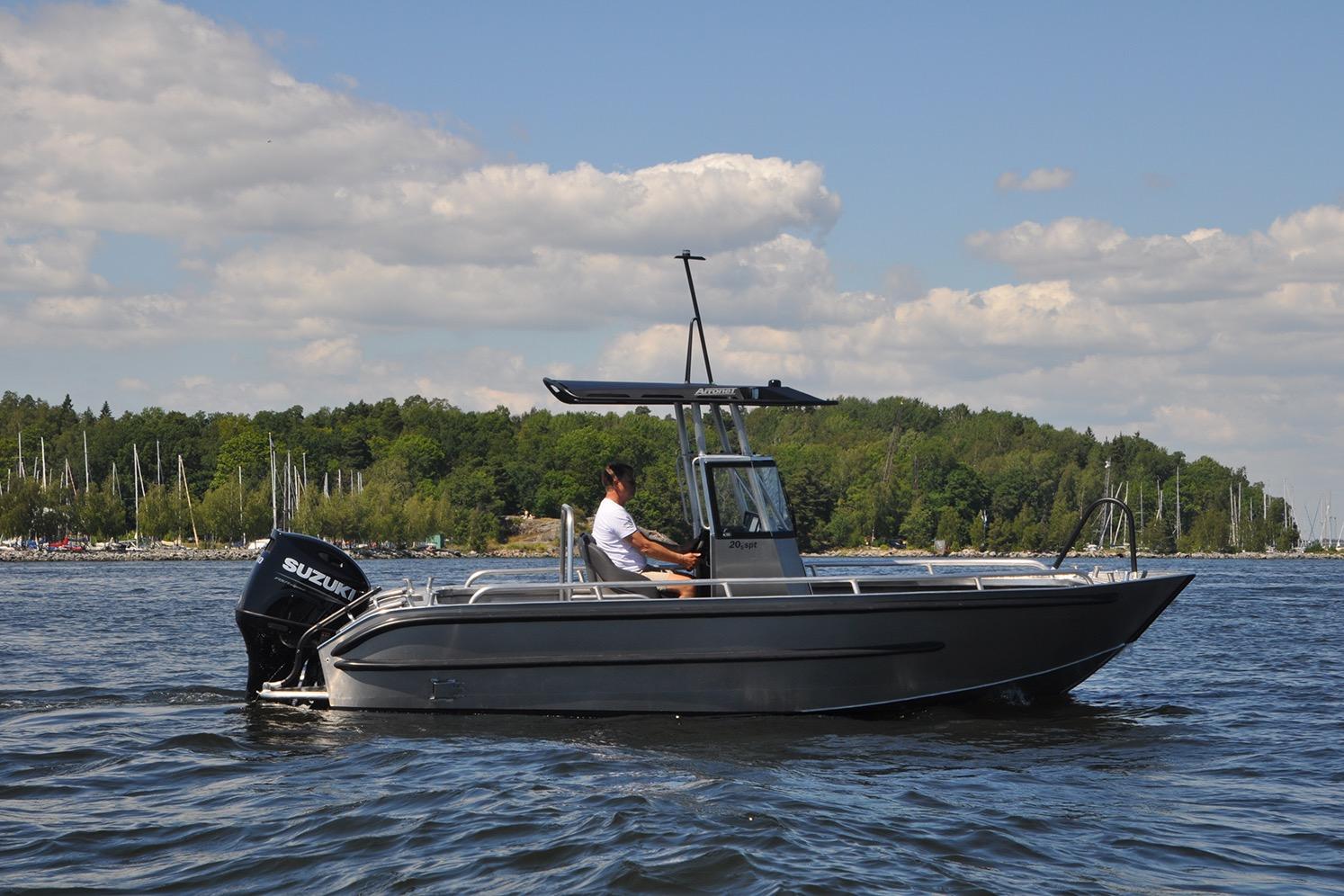 2024 Arronet 20 5 SPT boat on water, with Suzuki outboard motor, scenic background.