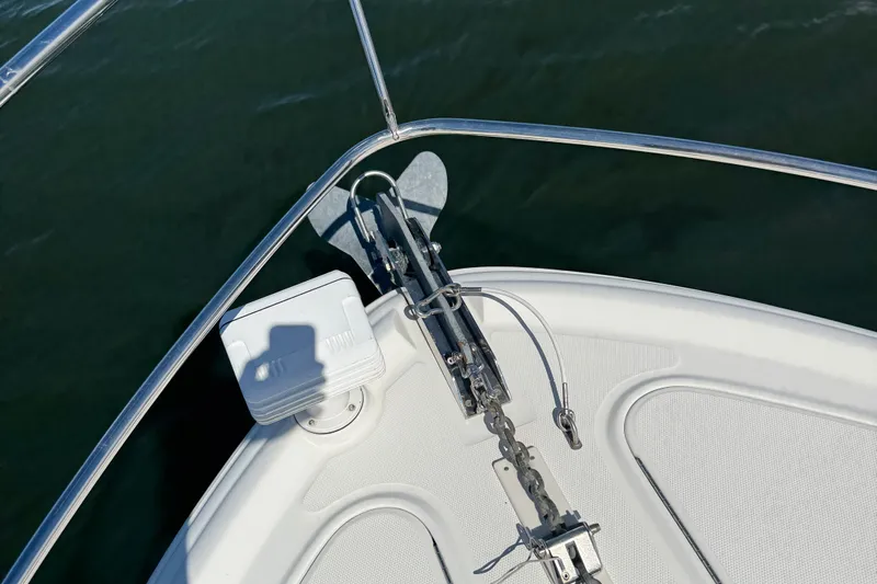  Yacht Photos Pics Bow of 2005 Sea Ray 420 Sundancer with anchor and railing over water.